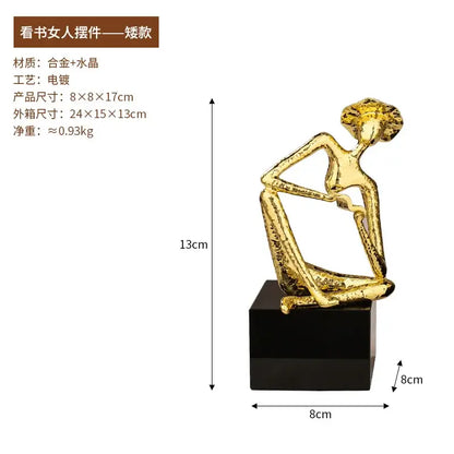 Abstract golden hat thinker figure living room gold & black decor