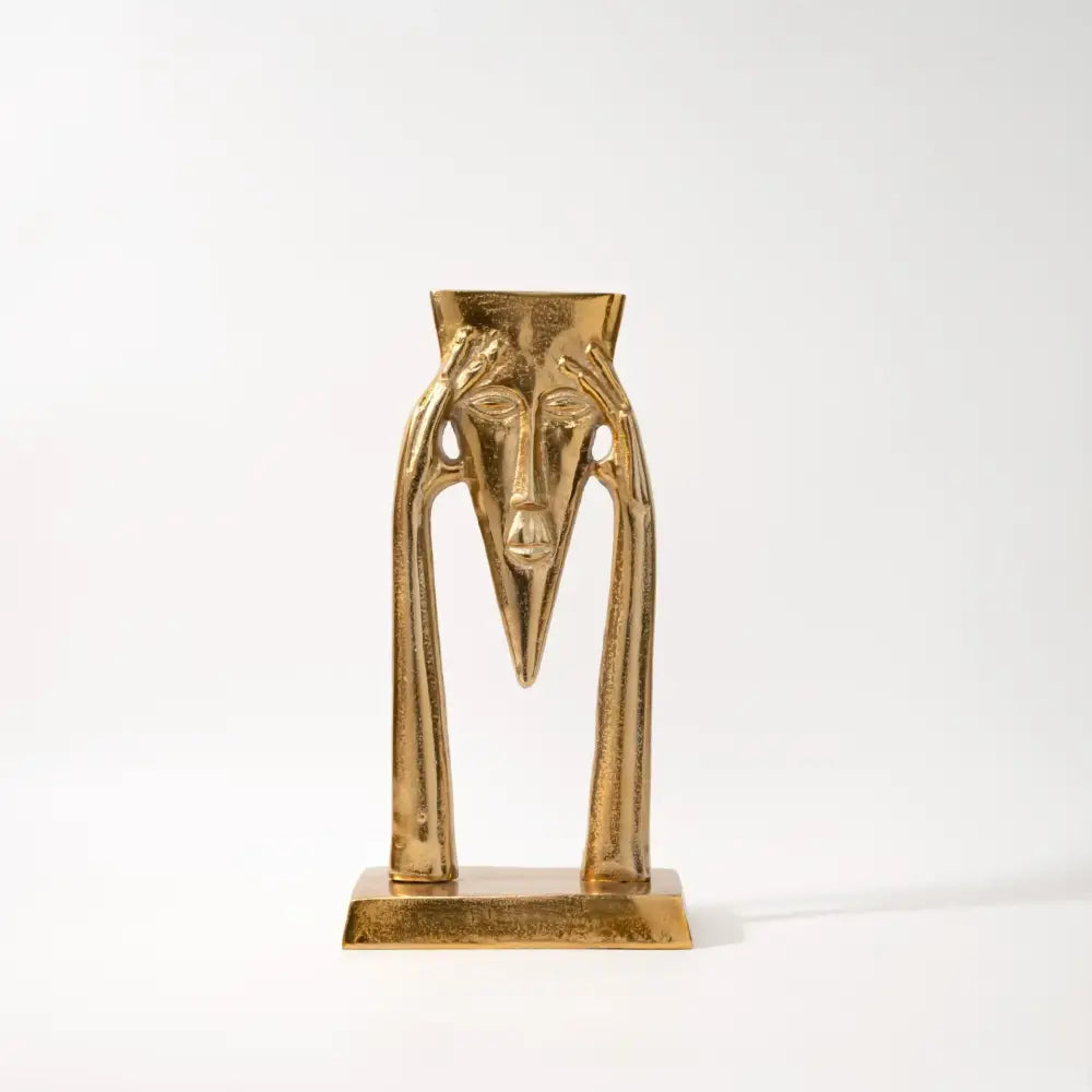 Abstract golden masked figure sculpture living room decor