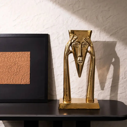 Abstract golden masked figure sculpture living room decor