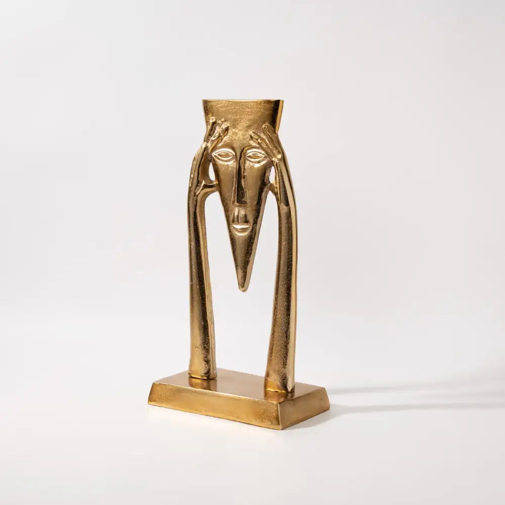 Abstract golden masked figure sculpture living room decor