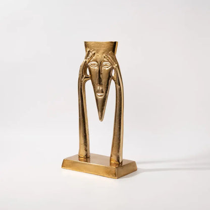 Abstract golden masked figure sculpture living room decor
