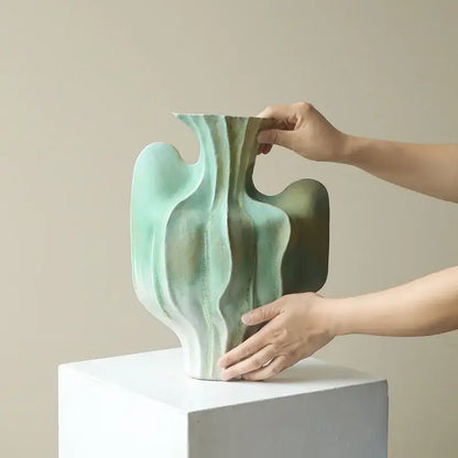 Abstract mint & olive ceramic vase with irregular folds living room