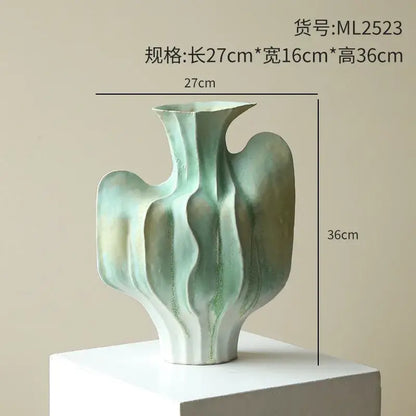 Abstract mint & olive ceramic vase with irregular folds living room