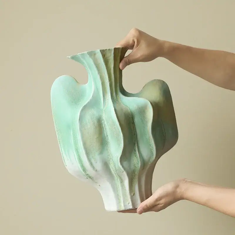 Abstract mint & olive ceramic vase with irregular folds living room