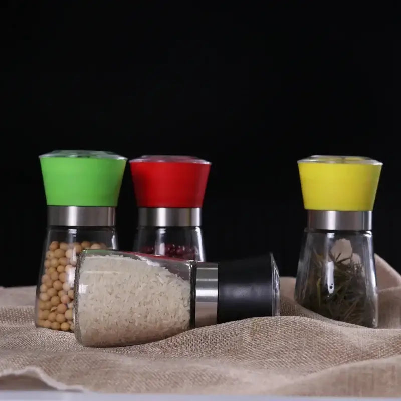 Adjustable spice grinder set with colorful silicone tops for kitchen