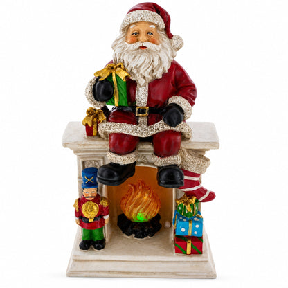 Santa Sitting on a Fireplace LED Lights Figurine 7.75 Inches