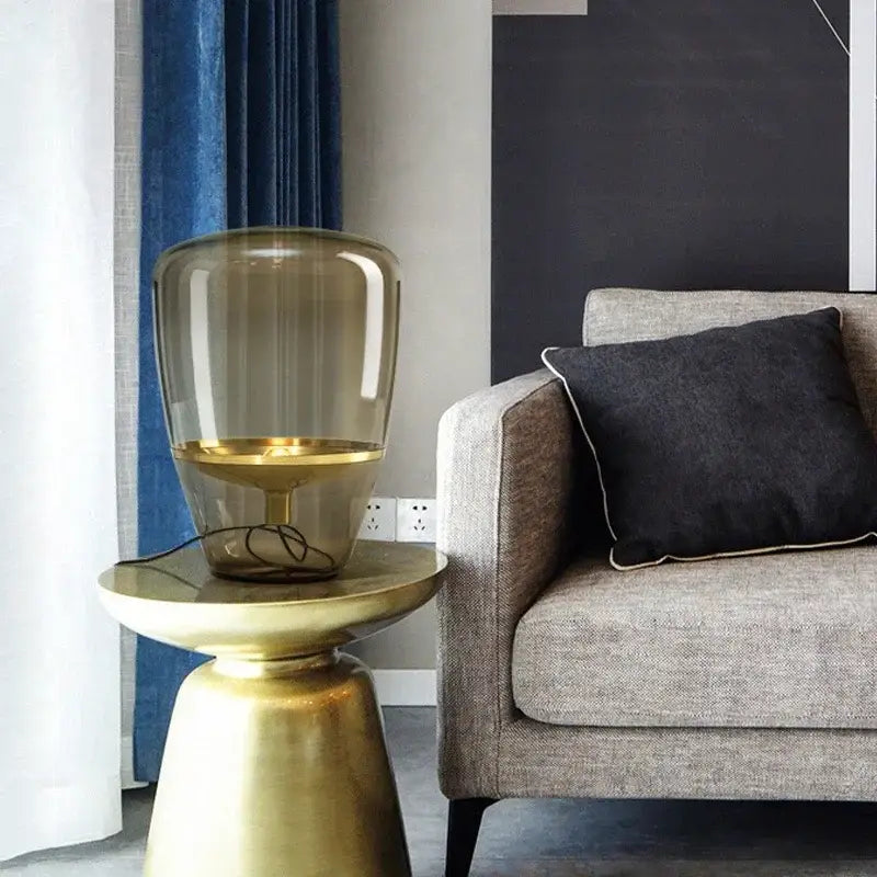 Amber glass and brass led table lamp for bedroom lighting