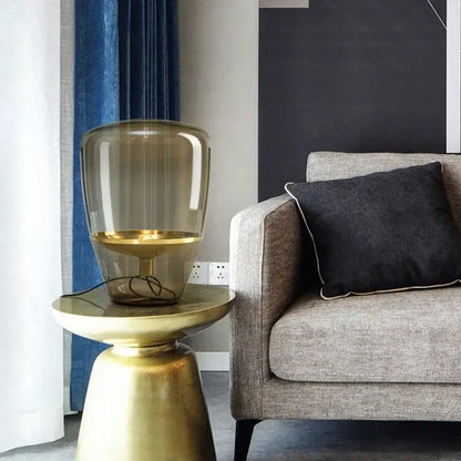 Amber glass and brass led table lamp for bedroom lighting
