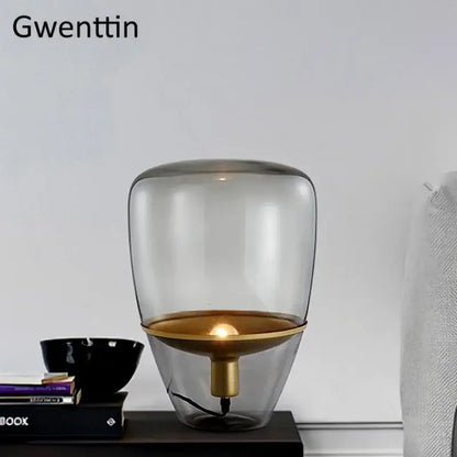 Amber glass and brass led table lamp for bedroom lighting