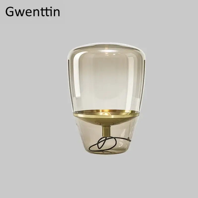 Amber glass and brass led table lamp for bedroom lighting