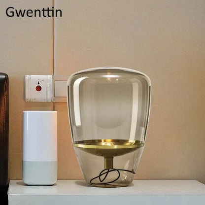 Amber glass and brass led table lamp for bedroom lighting