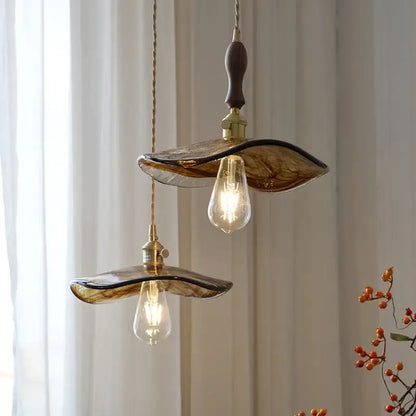 Amber glass pendant light with brass knob switch for dining room