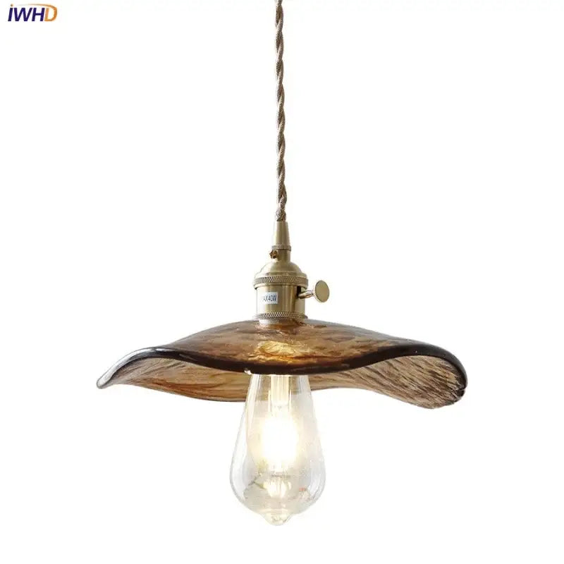 Amber glass pendant light with brass knob switch for dining room