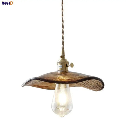 Amber glass pendant light with brass knob switch for dining room