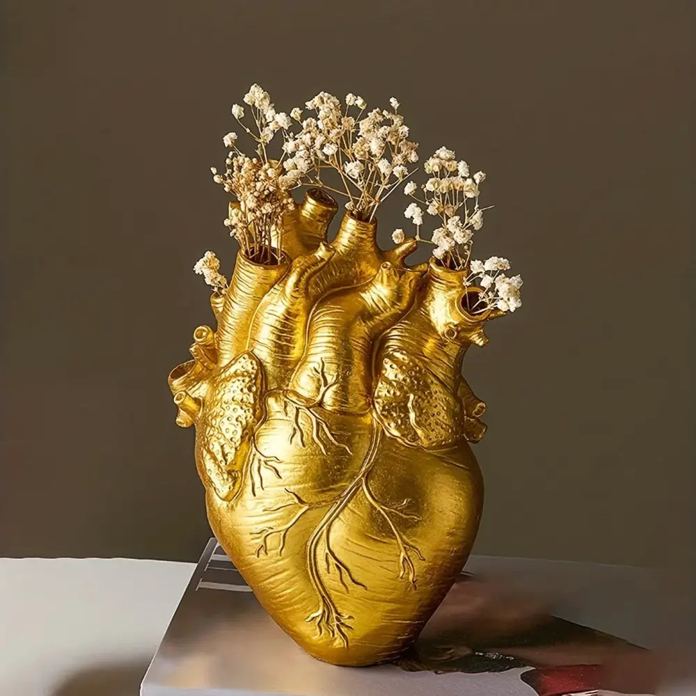 White anatomical heart vase with colorful flowers for living room