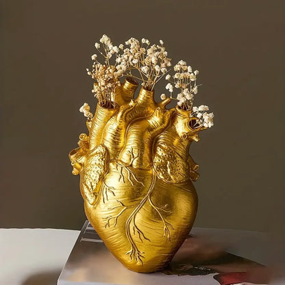 White anatomical heart vase with colorful flowers for living room