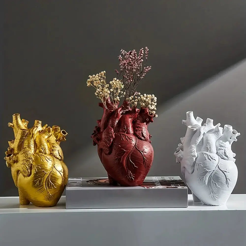 White anatomical heart vase with colorful flowers for living room