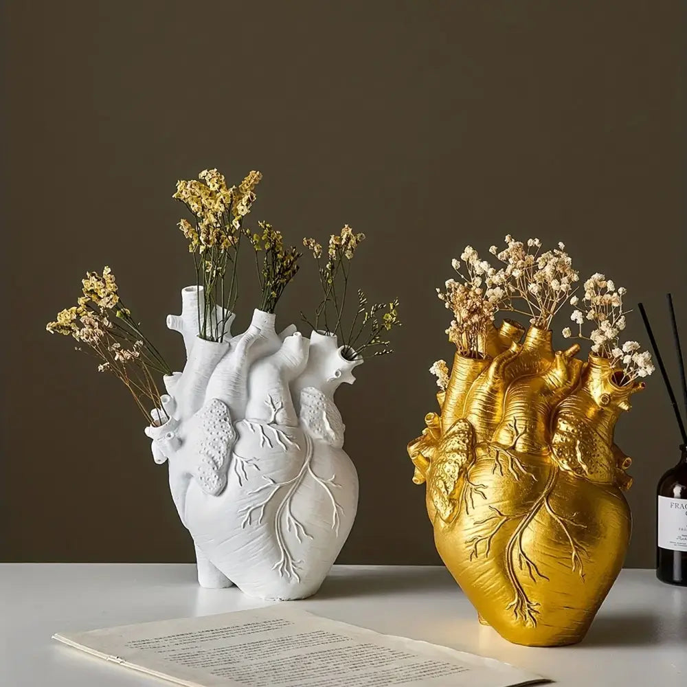 White anatomical heart vase with colorful flowers for living room