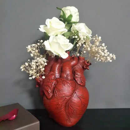White anatomical heart vase with branches for living room decor