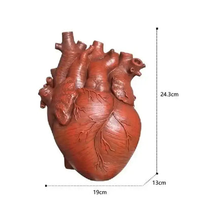 White anatomical heart vase with branches for living room decor