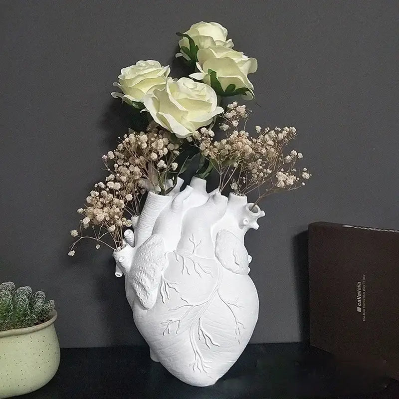 White anatomical heart vase with branches for living room decor