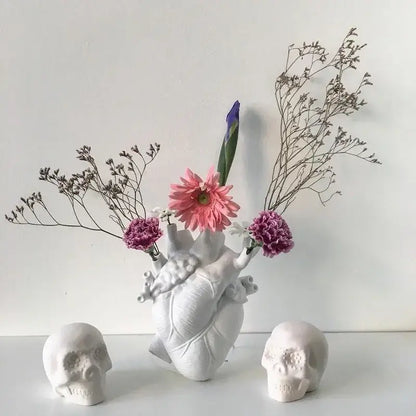 White anatomical heart vase with branches for living room decor