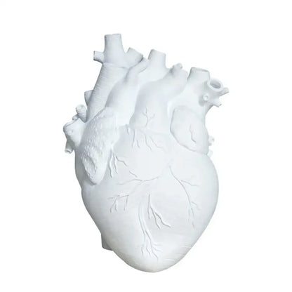 White anatomical heart vase with branches for living room decor