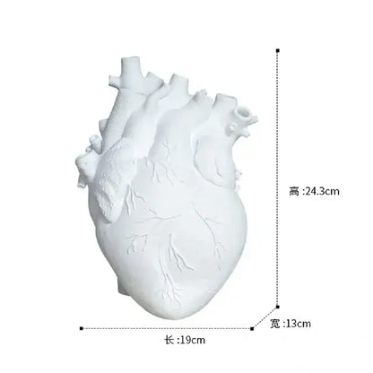 White anatomical heart vase with branches for living room decor