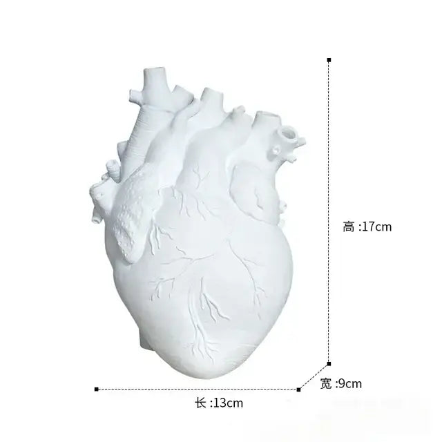 White anatomical heart vase with branches for living room decor