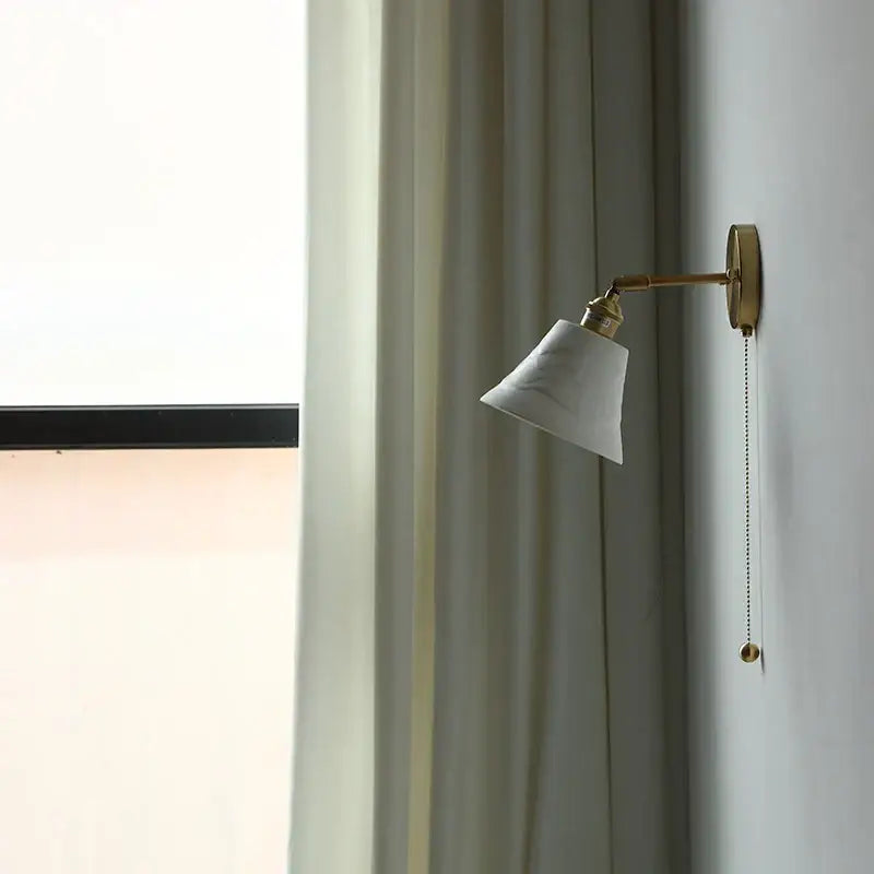 Antique brass and amber glass adjustable wall light bedroom sconce