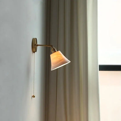Antique brass and amber glass adjustable wall light bedroom sconce