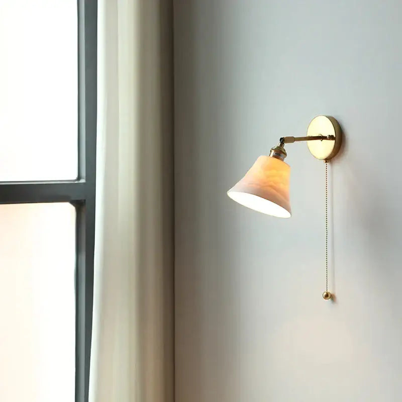 Antique brass and amber glass adjustable wall light bedroom sconce