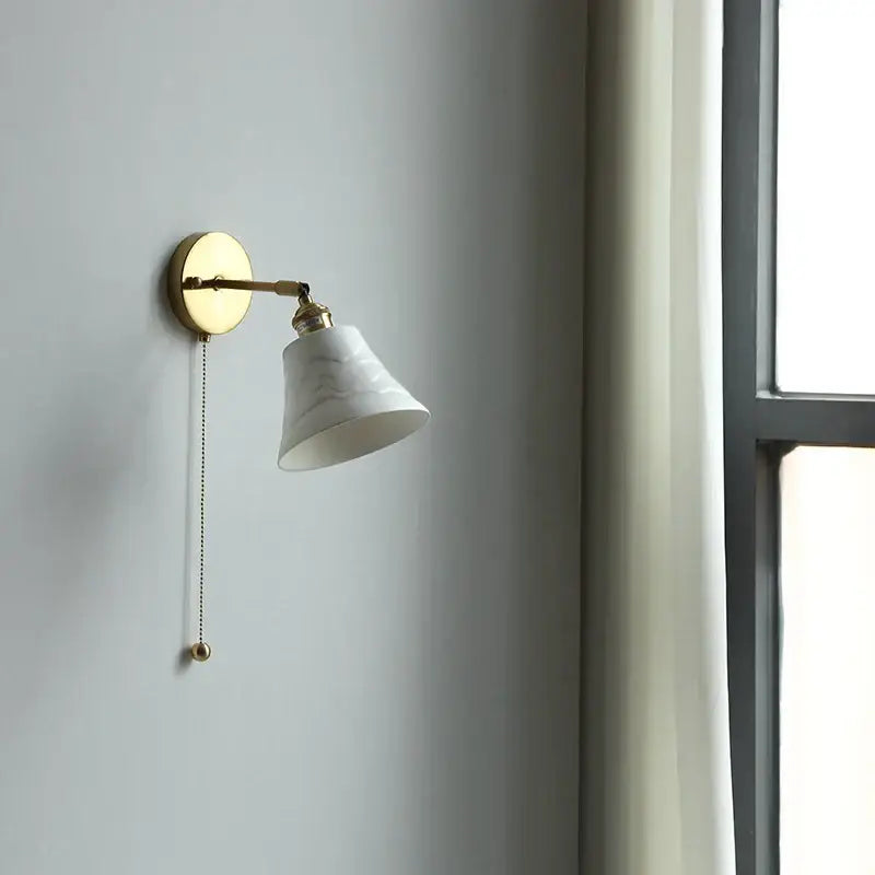 Antique brass and amber glass adjustable wall light bedroom sconce