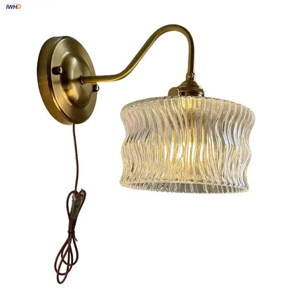 Antique brass and clear glass wall sconce bedroom light