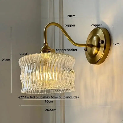 Antique brass and clear glass wall sconce bedroom light