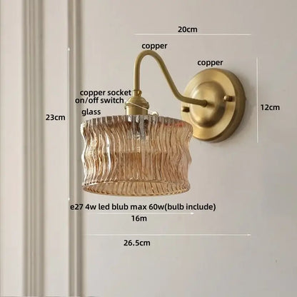 Antique brass and clear glass wall sconce bedroom light