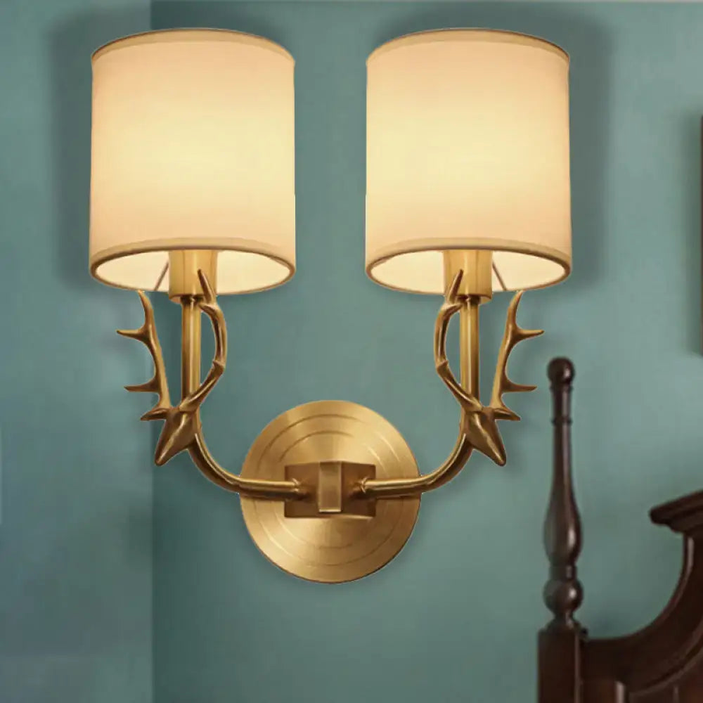 Antique brass antler wall sconce with fabric shade – bedroom light