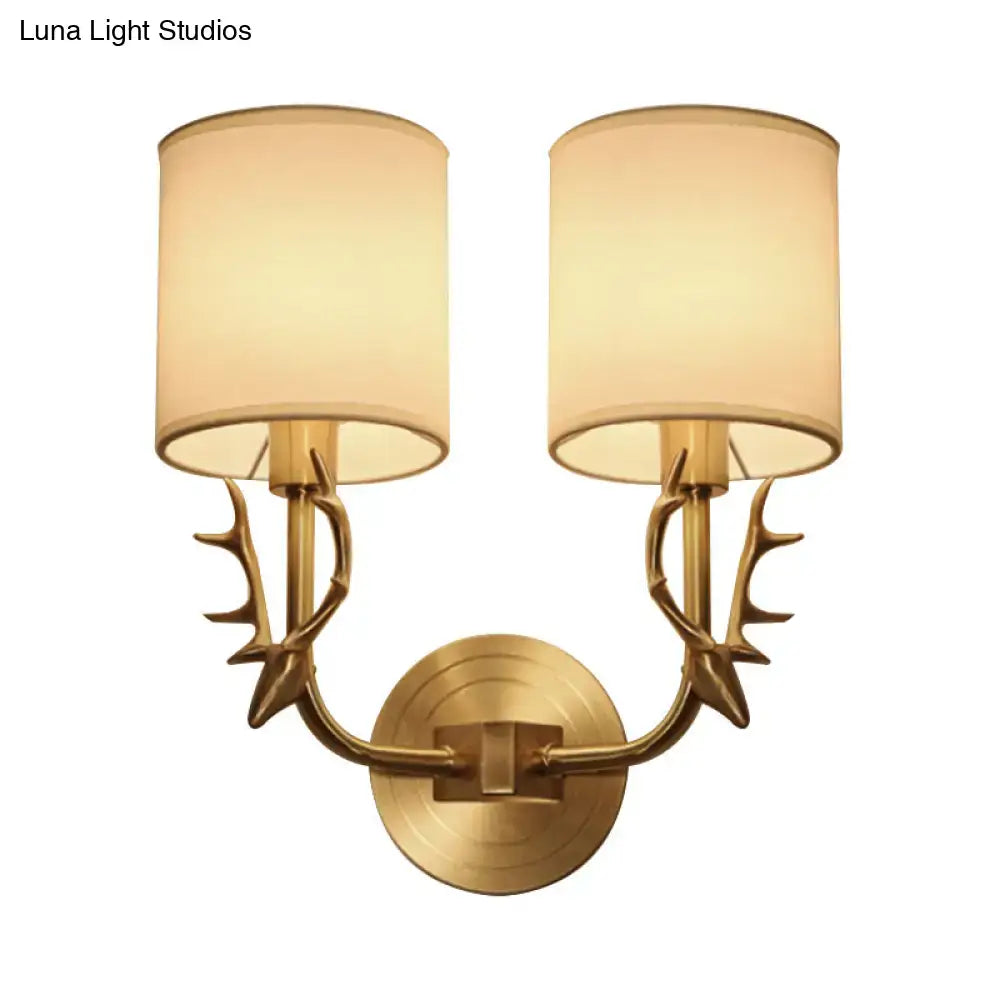 Antique brass antler wall sconce with fabric shade – bedroom light