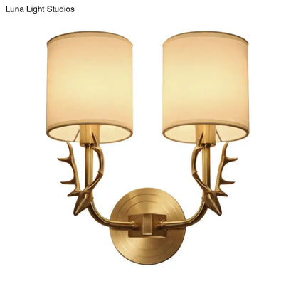 Antique brass antler wall sconce with fabric shade – bedroom light
