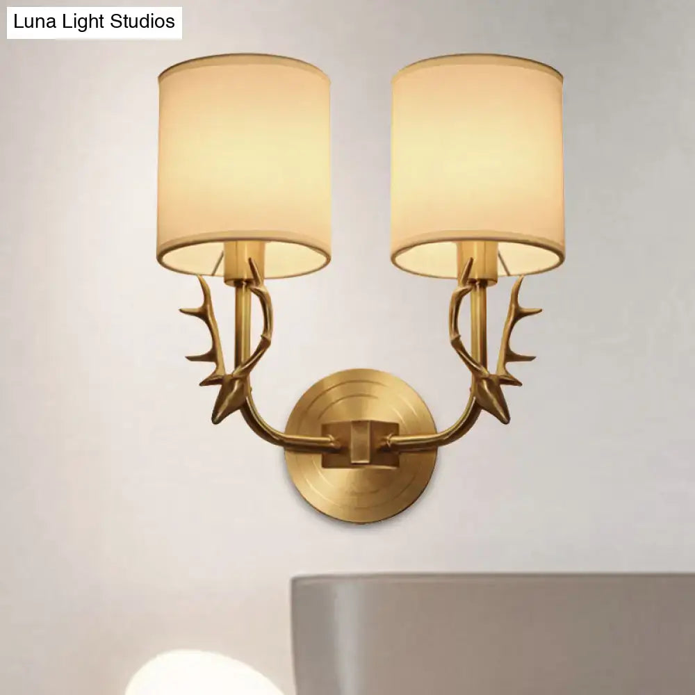 Antique brass antler wall sconce with fabric shade – bedroom light