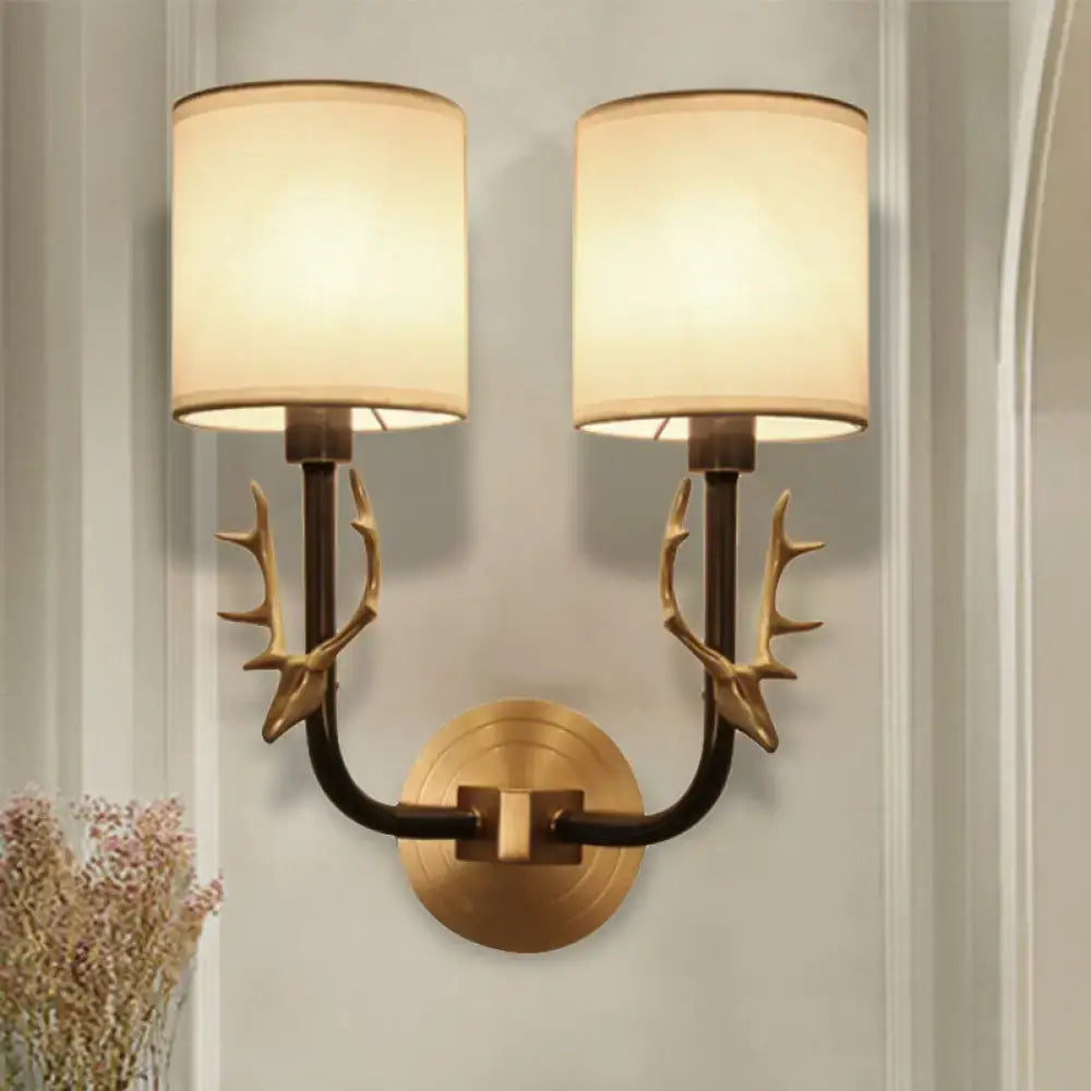 Antique brass antler wall sconce with fabric shade – bedroom light