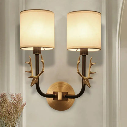 Antique brass antler wall sconce with fabric shade – bedroom light