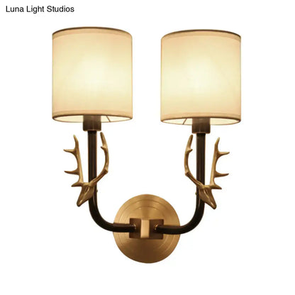Antique brass antler wall sconce with fabric shade – bedroom light