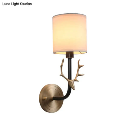 Antique brass antler wall sconce with fabric shade – bedroom light