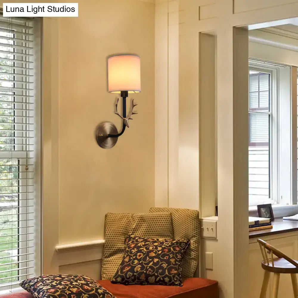 Antique brass antler wall sconce with fabric shade – bedroom light