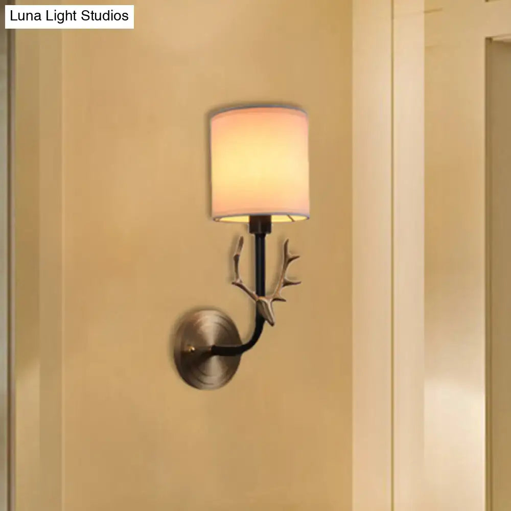 Antique brass antler wall sconce with fabric shade – bedroom light