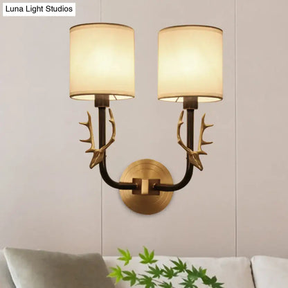 Antique brass antler wall sconce with fabric shade – bedroom light