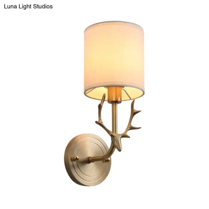 Antique brass antler wall sconce with fabric shade – bedroom light