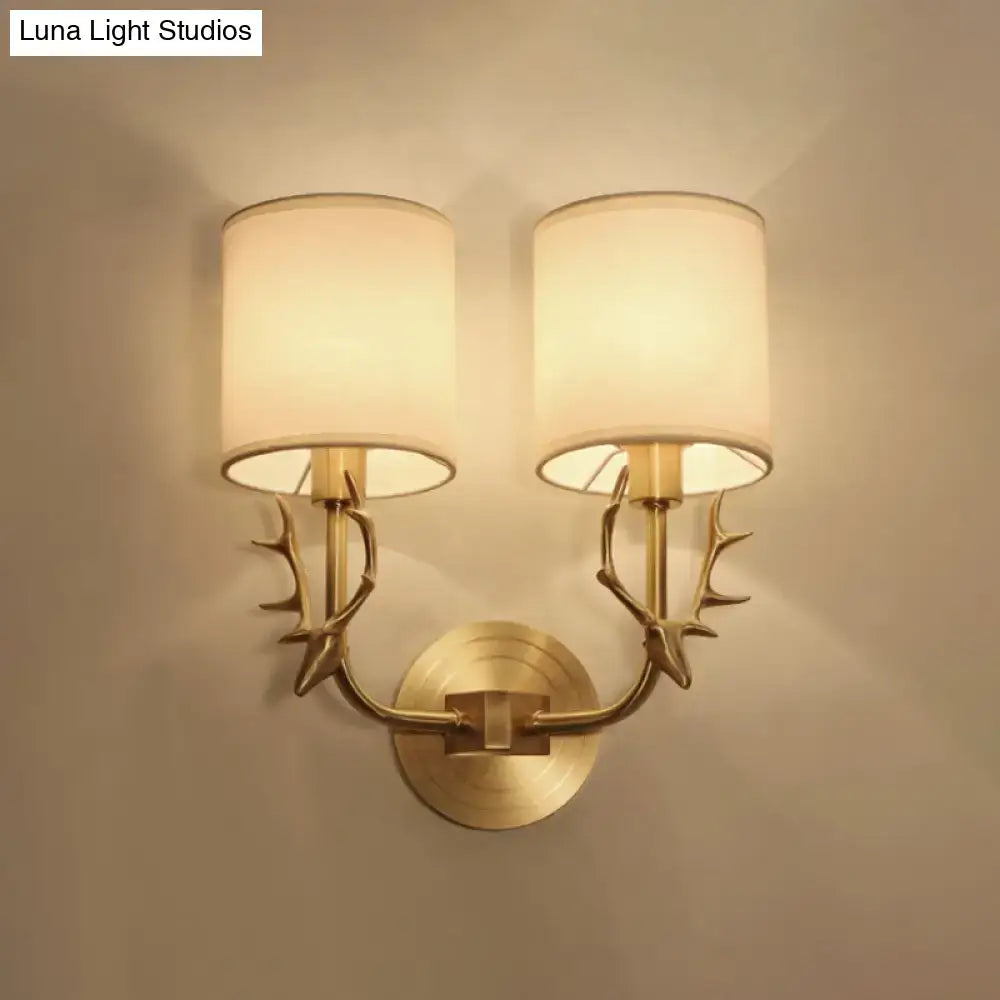 Antique brass antler wall sconce with fabric shade – bedroom light