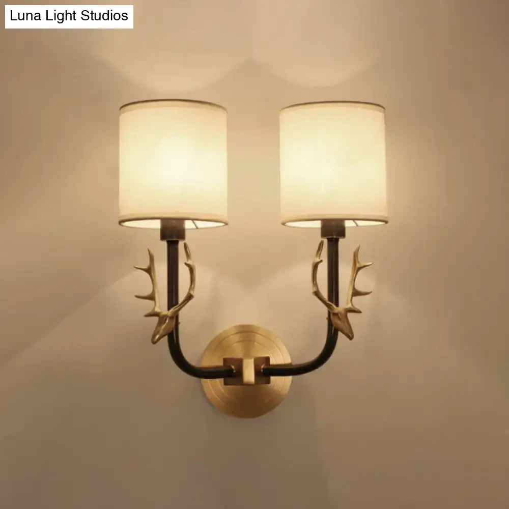 Antique brass antler wall sconce with fabric shade – bedroom light